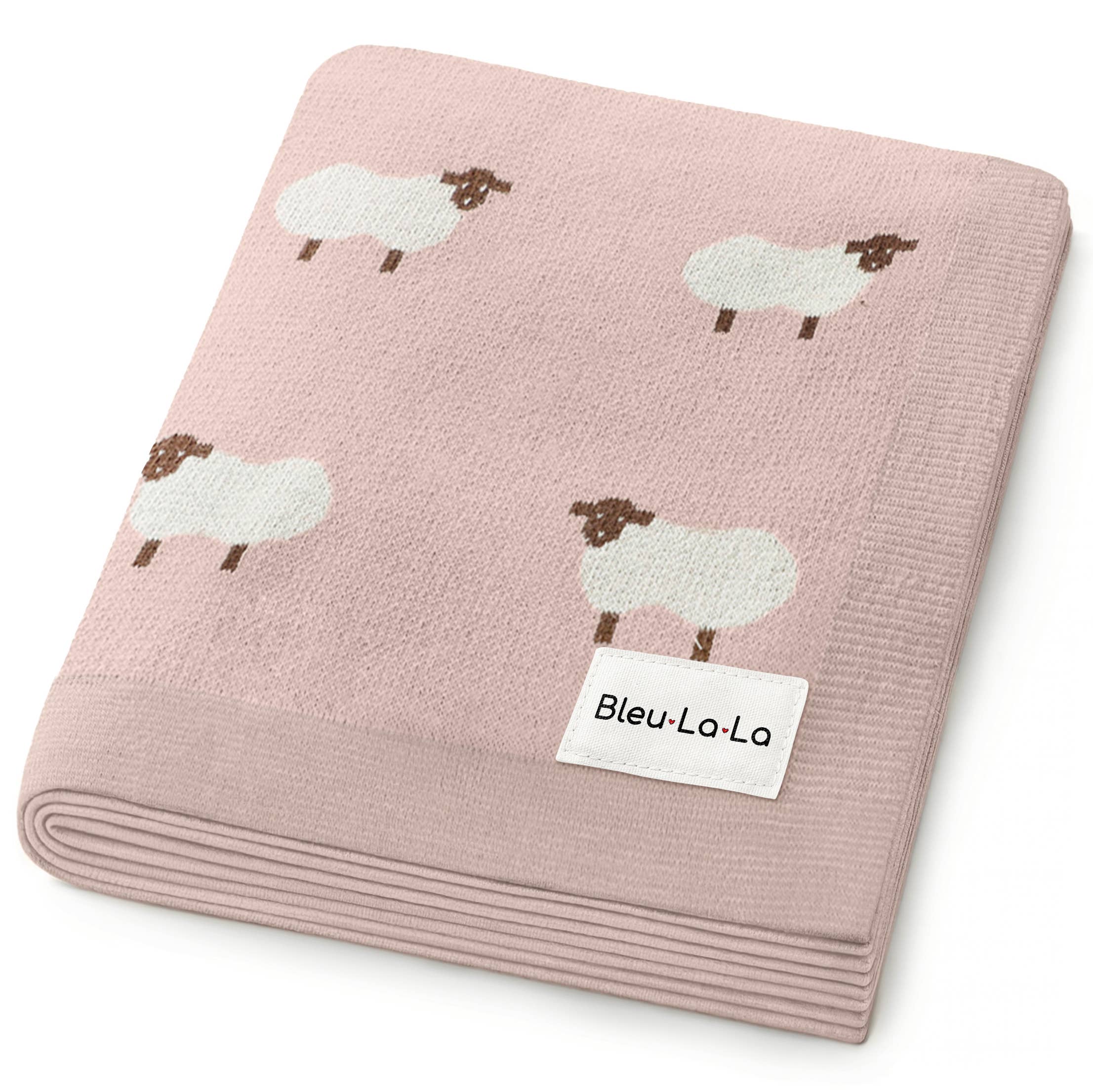 Pink blanket with sheep pattern and Bleu-La-La label on a white background