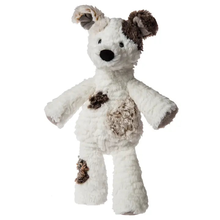 White plush dog toy with brown patches on a white background