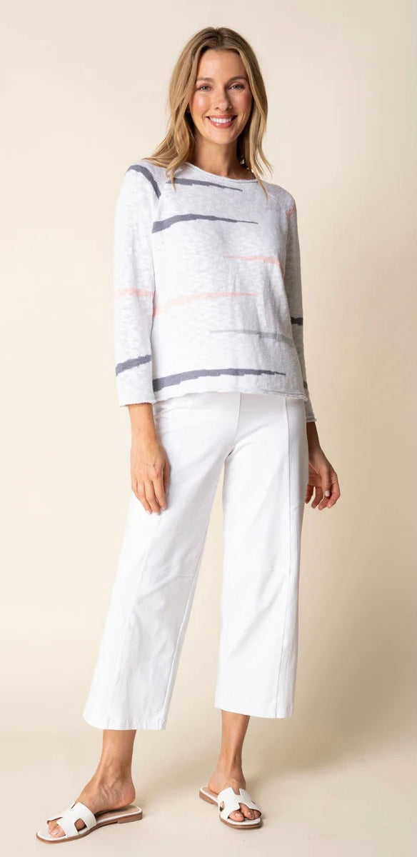 Habitat Boardwalk Pullover in white with grey and blush stripe, full-length front view styled with white wide-leg culottes and white slide sandals