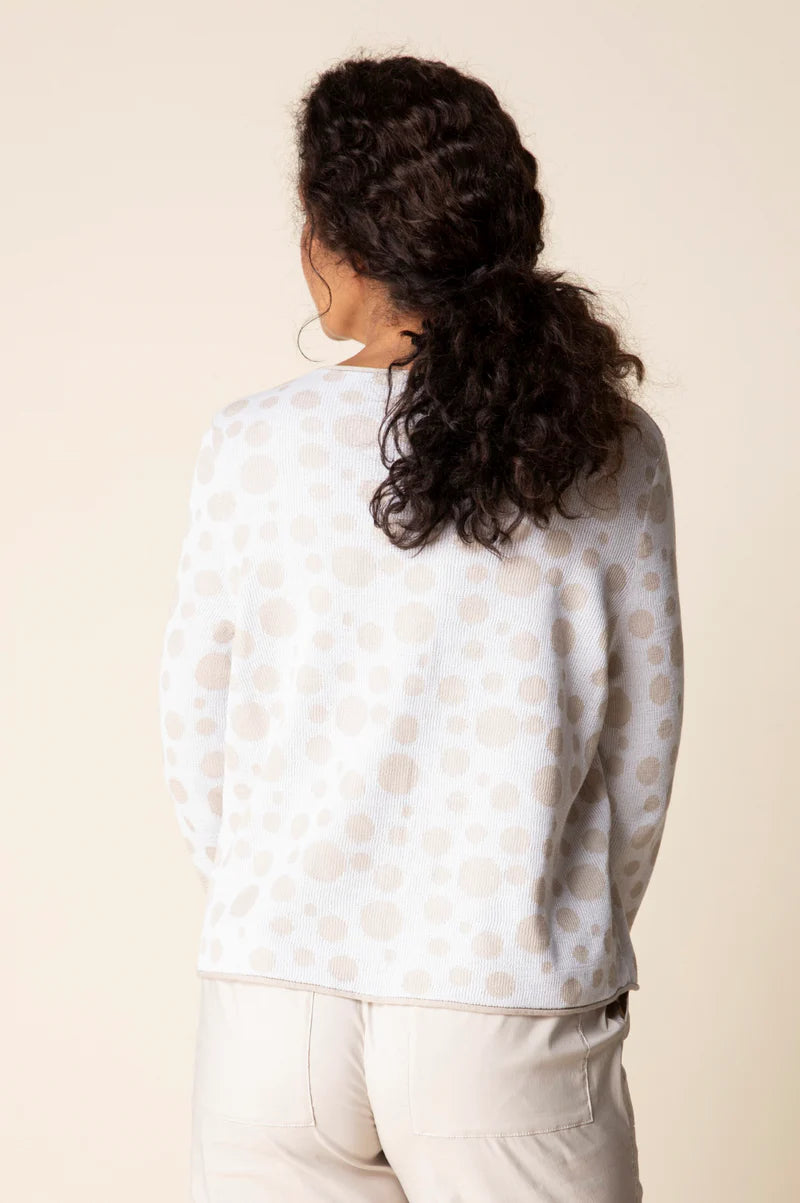 Front view — "Habitat Women's Connect The Dots Pullover in white with tan dot print, front view, model smiling with hands in pockets"
Front three-quarter — "Habitat Women's Connect The Dots Pullover in white with tan dot print, front three-quarter view, model touching neckline"
Back view — "Habitat Women's Connect The Dots Pullover in white with tan dot print, back view showing relaxed fit and dot pattern"
Back close-up — "Habitat Women's Connect The Dots Pullover in white with tan dot print, close-up back
