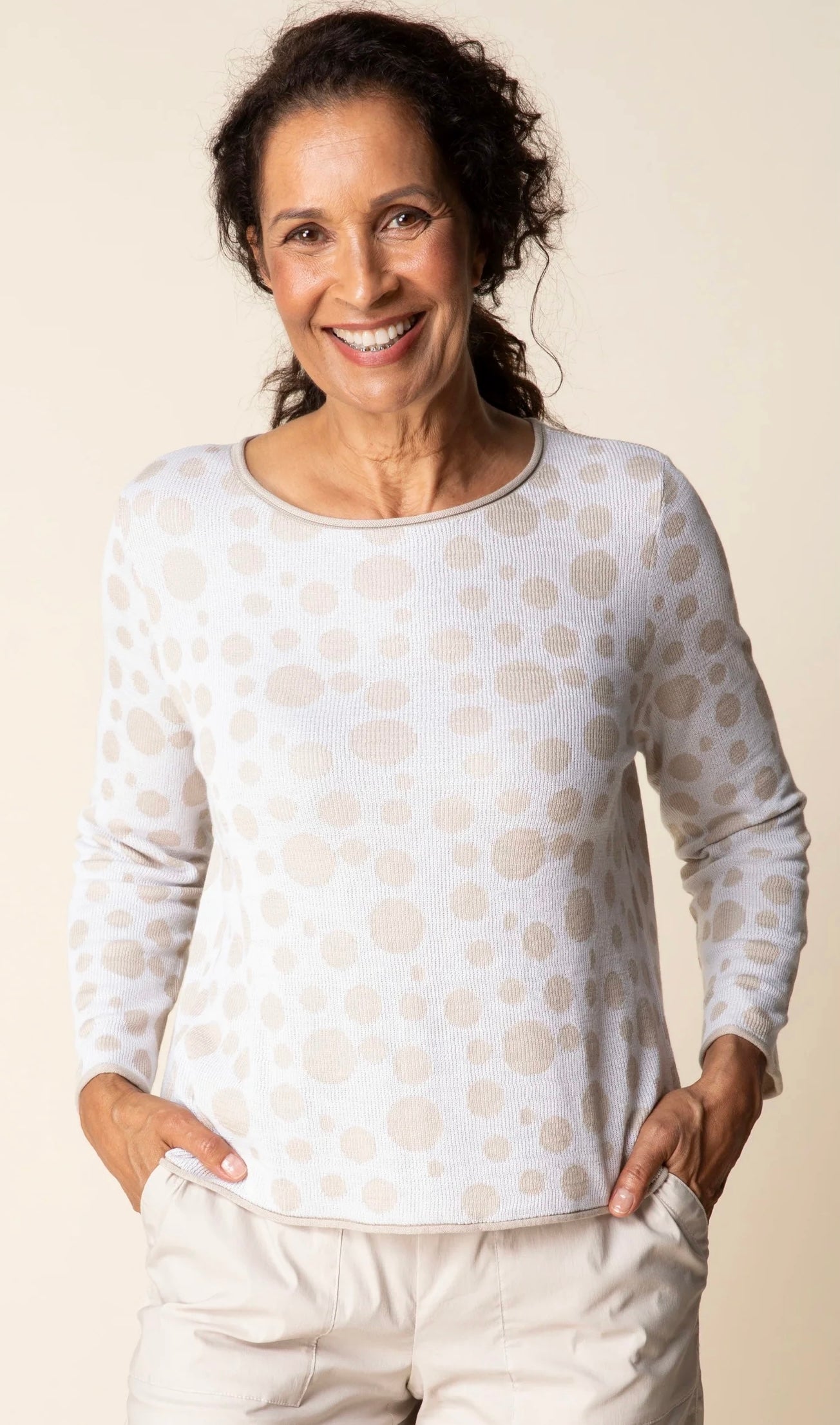 Front view — "Habitat Women's Connect The Dots Pullover in white with tan dot print, front view, model smiling with hands in pockets"
Front three-quarter — "Habitat Women's Connect The Dots Pullover in white with tan dot print, front three-quarter view, model touching neckline"
Back view — "Habitat Women's Connect The Dots Pullover in white with tan dot print, back view showing relaxed fit and dot pattern"
Back close-up — "Habitat Women's Connect The Dots Pullover in white with tan dot print, close-up back