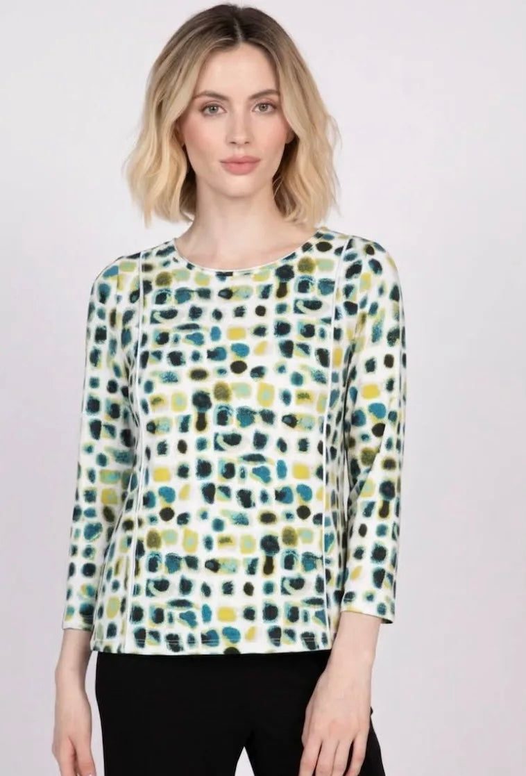 Image 1 (front, full body): Women's essential knit dot layer tee in teal, olive, and yellow dot print with 3/4 sleeves, front view
Image 2 (front, cropped torso): Close-up of women's knit dot layer tee showing teal, olive, and yellow abstract dot pattern with 3/4 sleeves
Image 3 (front, mid-crop): Women's knit dot layer tee in multicolor dot print, scoop neckline and 3/4 sleeves, cropped front view
Image 4 (fabric detail): Detail of abstract dot print fabric in teal, yellow, and black on white knit, women's