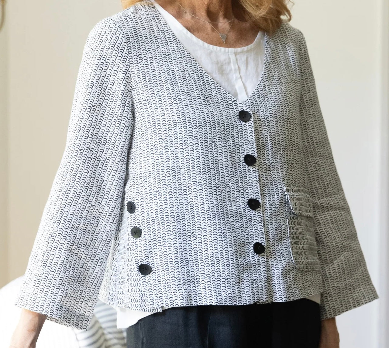 Close-up front view of Olivia Women's Flax Stripe Button Jacket showing scallop texture, black buttons, and patch pocket
