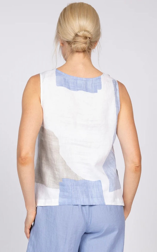 "Back view of Olivia Coastal Colorblock Sunset Tank in blue and white colorblock linen, styled with blue wide-leg pants"