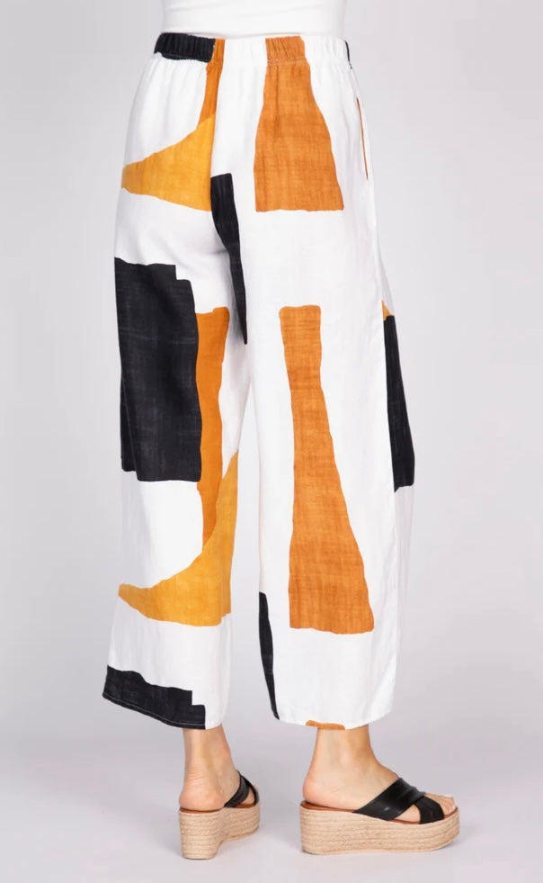 "Olivia Women's Coastal Colorblock Breeze Pant back view with pull-on waistband and bold amber and black abstract print on white linen"