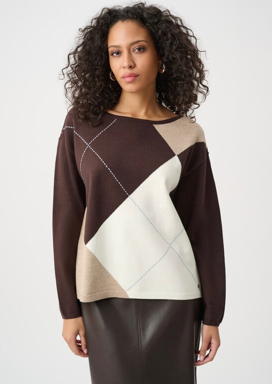 "Joseph Ribkoff Women's Classic Crewneck Sweater in chocolate brown, taupe, and cream argyle colorblock, front view on curly-haired model styled with brown faux leather pencil skirt, white background"