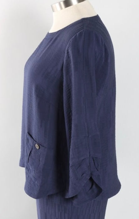 A navy blue textured long-sleeve top displayed on a mannequin torso against a light gray background.