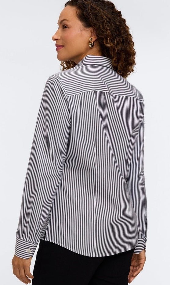 A woman shown from the back wearing a long-sleeve button-up shirt with thin vertical black and white stripes, paired with black pants, against a plain white studio background. - OLIVIA'S
