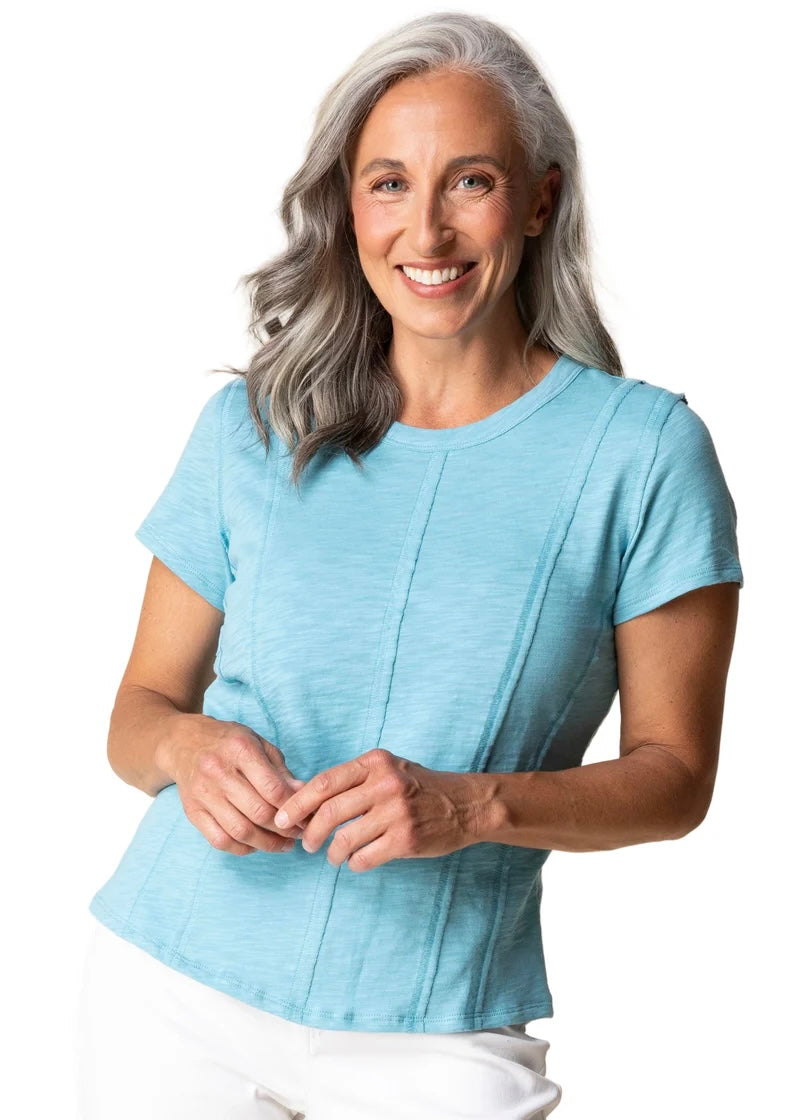 Woman wearing a light blue shirt on a white background