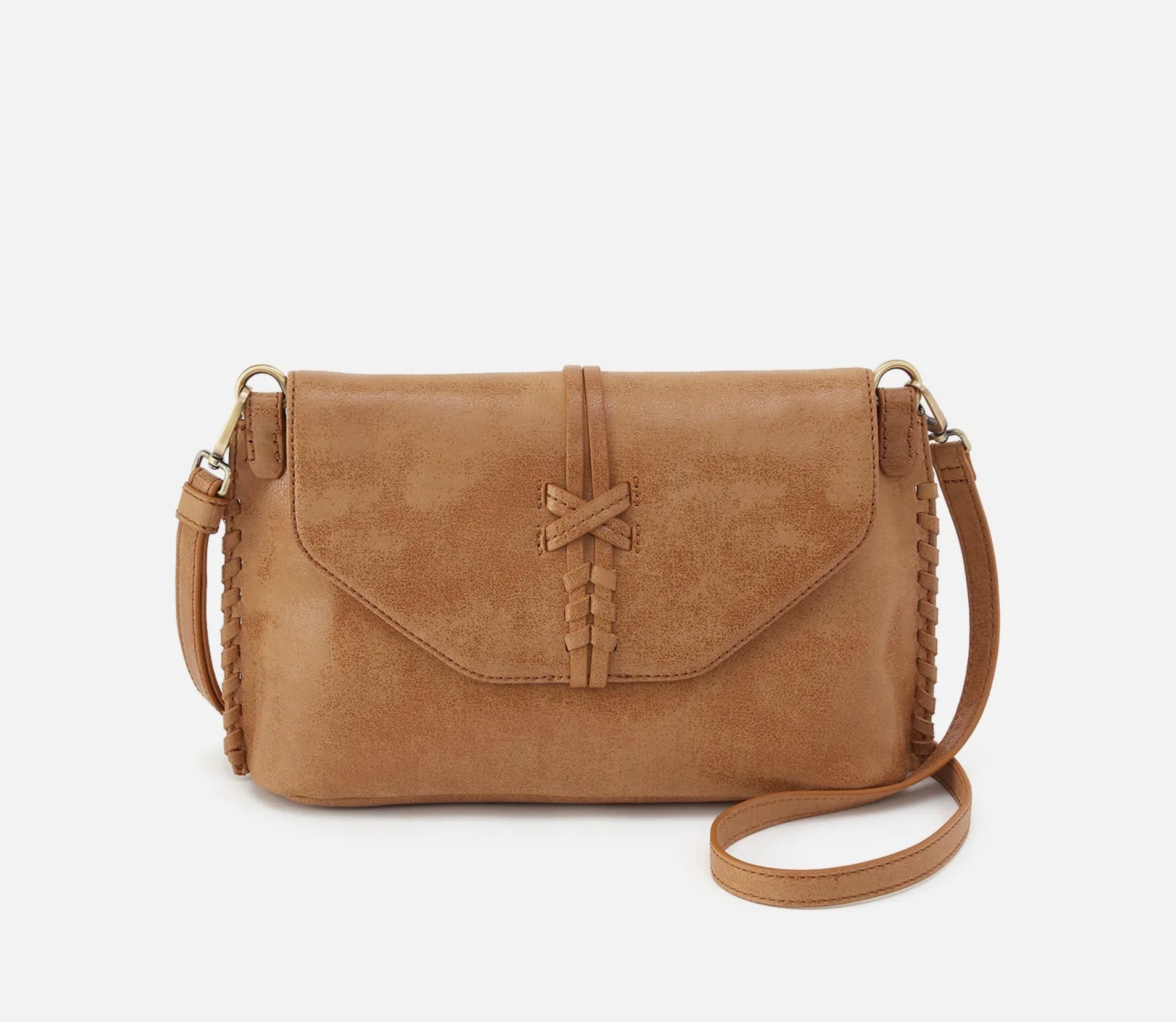 Brown leather handbag with a strap on a white background