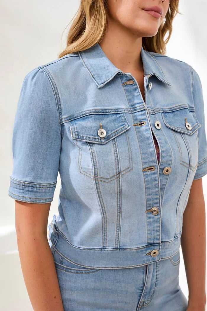 Light blue denim jacket worn by a person on a white background
