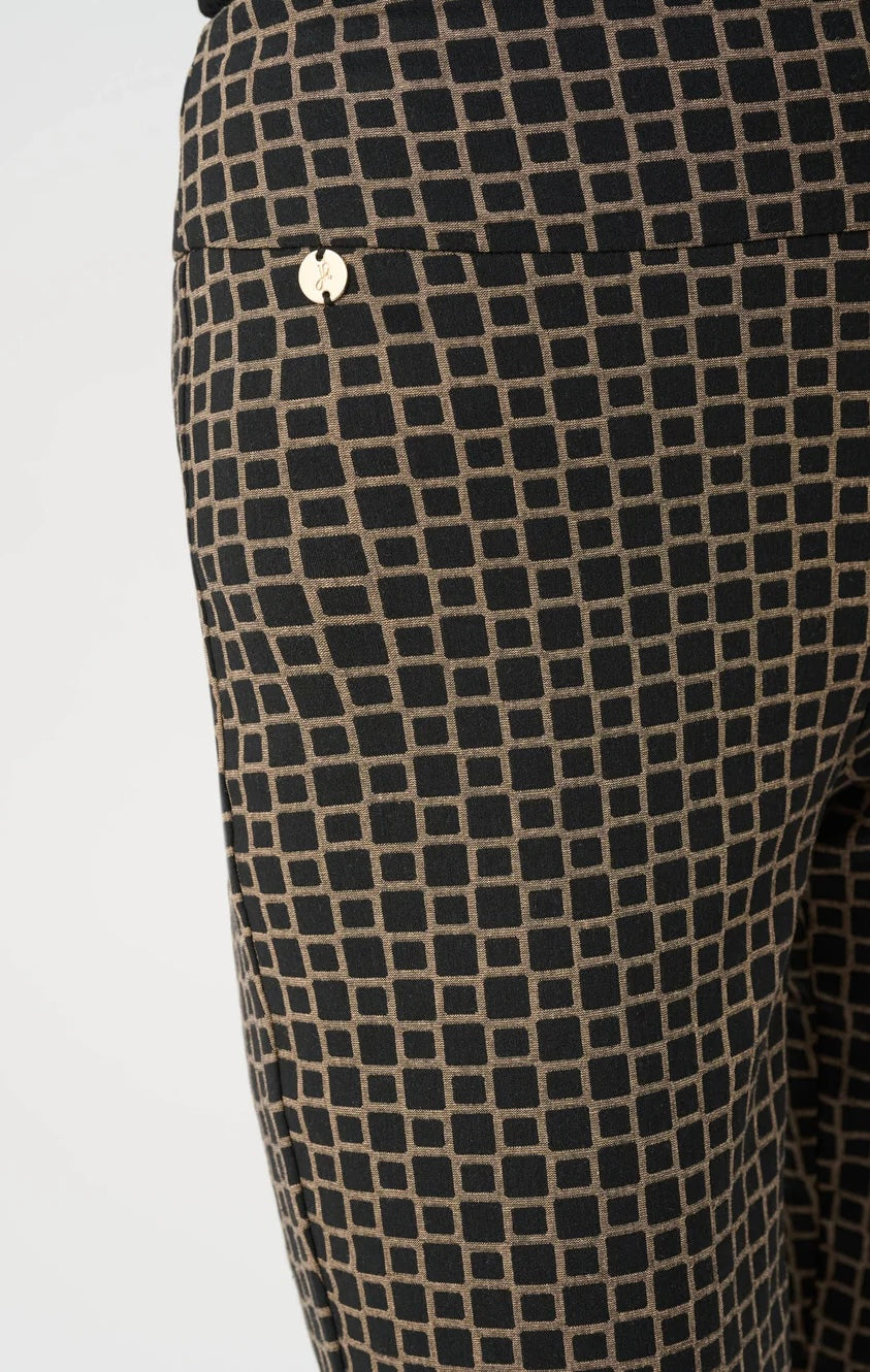 Joseph Ribkoff Geometric Jacquard Straight Pull-On Pant in black and gold, full-length front view styled with black sleeveless turtleneck and black slingback heels
