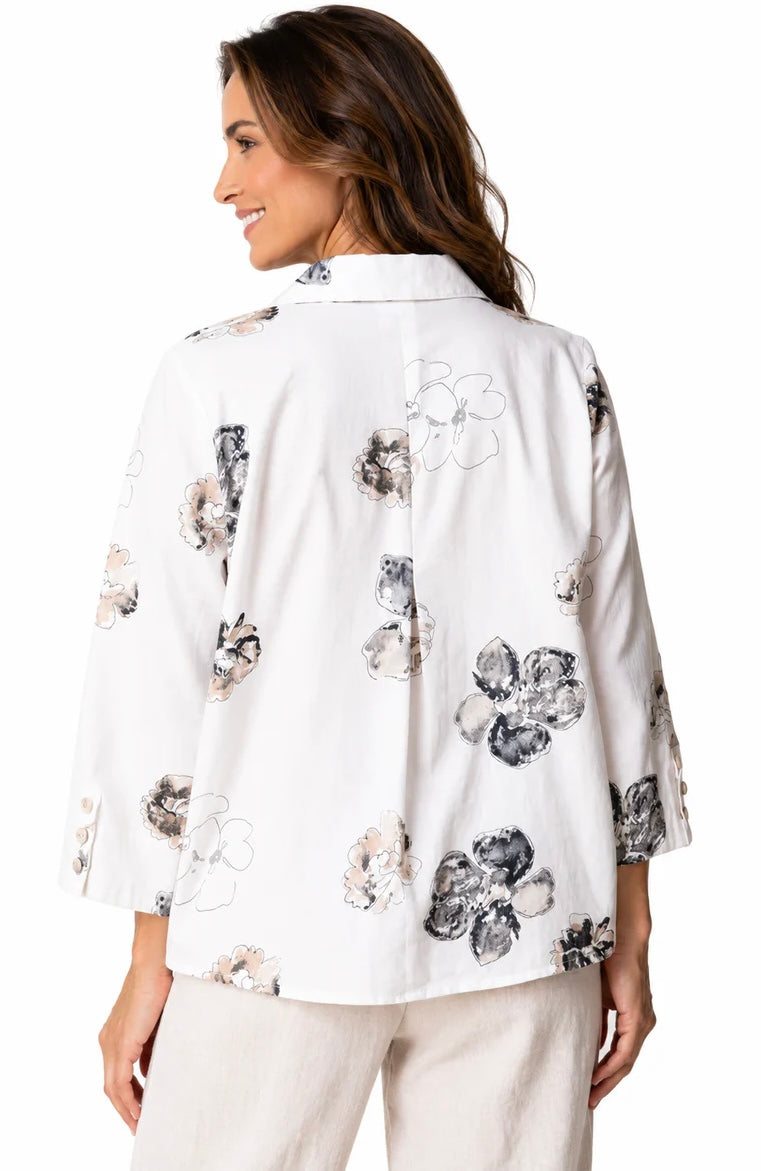 Front view (brunette model) — "Habitat Women's Watercolor Floral Swing Shirt in white with navy and taupe floral print, front view, smiling brunette model styled with linen trousers"
Back view (brunette model) — "Habitat Women's Watercolor Floral Swing Shirt in white with navy and taupe floral print, back view showing relaxed swing silhouette and 3/4 sleeves"
Close-up front — "Habitat Women's Watercolor Floral Swing Shirt in white with navy and taupe floral print, cropped front close-up showing button plack