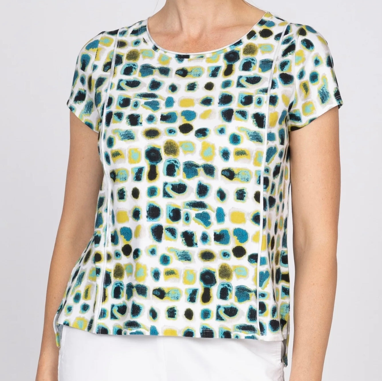 Image 1 (front, full): "Women's dot print knit tee in teal, yellow, and black on white background, front view, round neckline, short sleeves"
Image 2 (back, full): "Women's dot print knit tee in teal, yellow, and black, back view showing relaxed silhouette and short sleeves"
Image 3 (front, torso crop): "Women's dot print knit tee, front torso close-up showing round neckline and abstract dot pattern in teal, yellow, and black"
Image 4 (neckline detail): "Close-up detail of women's knit tee neckline and abst