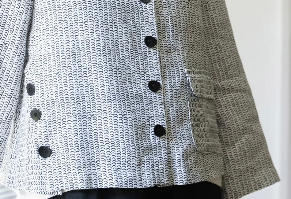 Detail of Olivia Women's Flax Stripe Button Jacket showing full button placket, patch pocket, and A-line hem