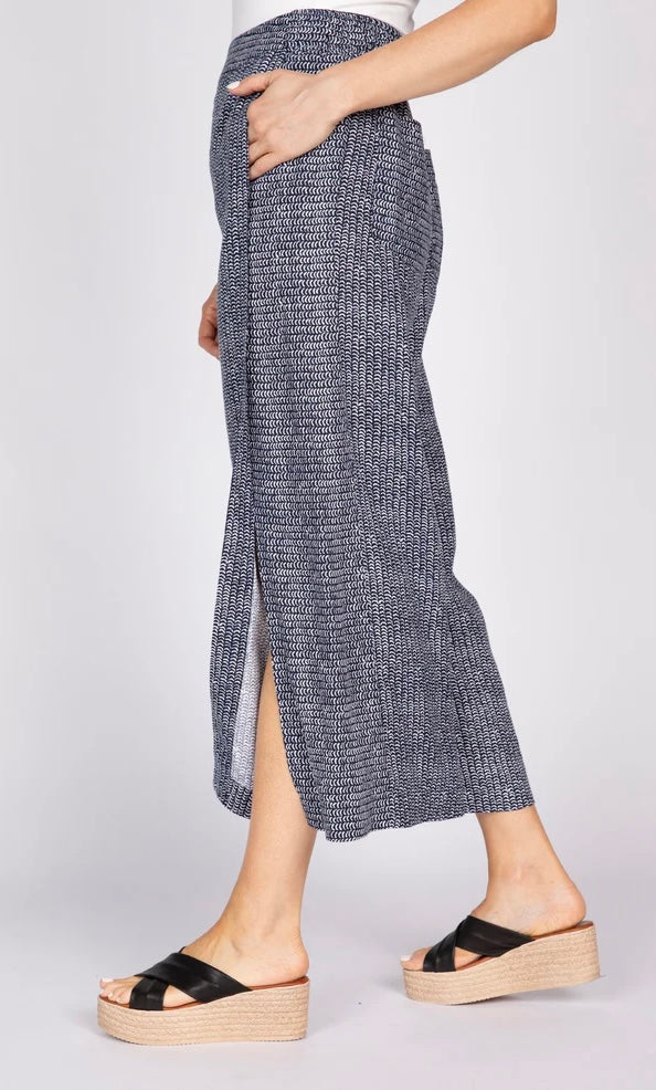 Olivia by Habitat Gemma Flood wide-leg linen flood pant in navy print, side view with hand in pocket