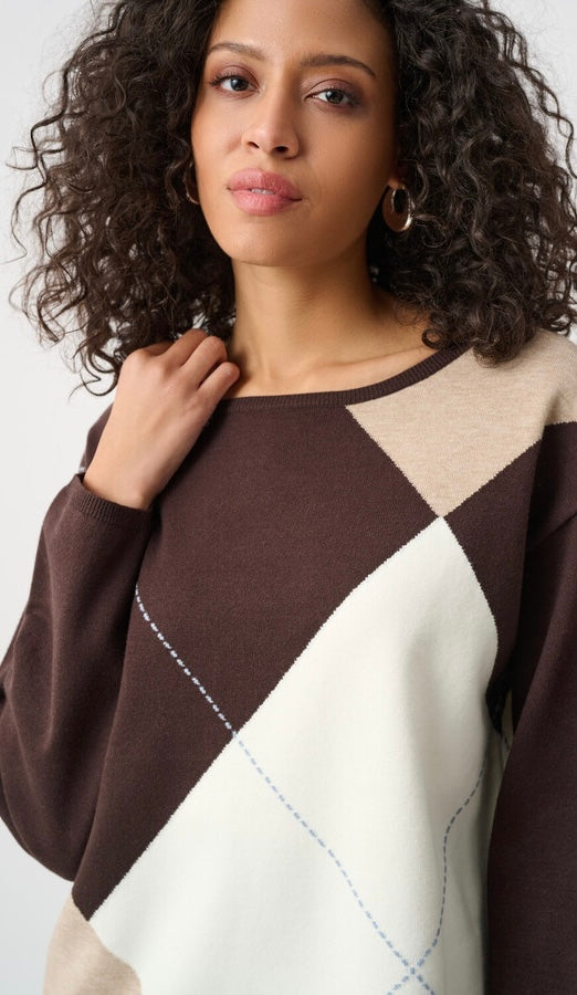 Joseph Ribkoff Women's Classic Crewneck Sweater in chocolate brown, taupe, and cream argyle colorblock, close-up front view on curly-haired model highlighting crewneck, colorblock diamond pattern, and tonal stitch detail"