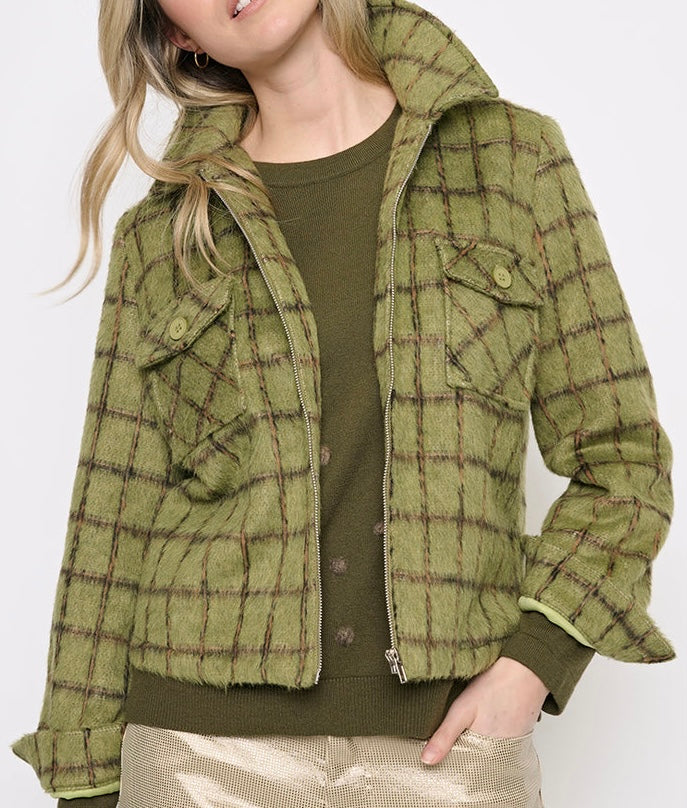 A woman wearing a cropped olive green plaid jacket with a hood, layered over an olive green top and paired with metallic gold pants, shown against a plain white background. - OLIVIA'S