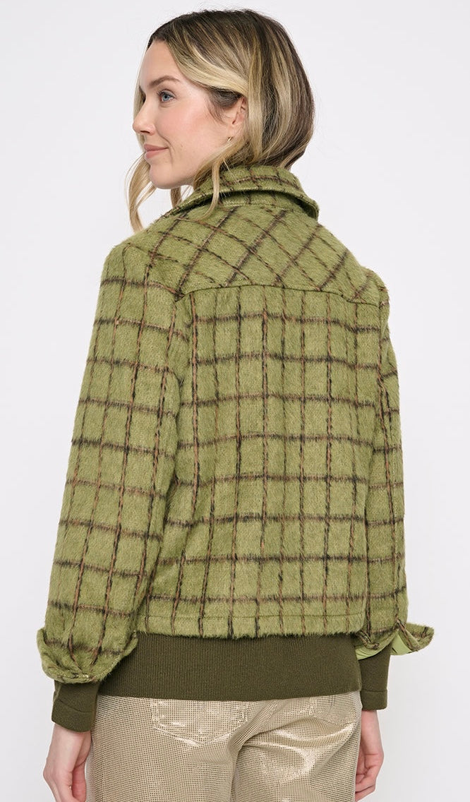 A woman shown from the back wearing a textured olive green plaid jacket with a high collar and long sleeves, paired with metallic gold pants, against a plain white background. - OLIVIA'S