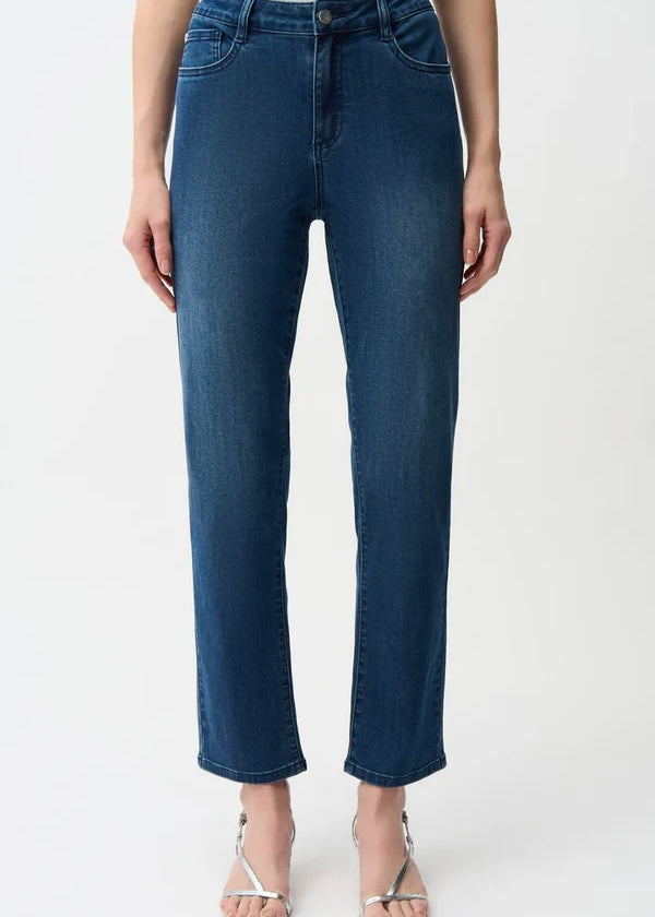 Person wearing blue jeans on a white background