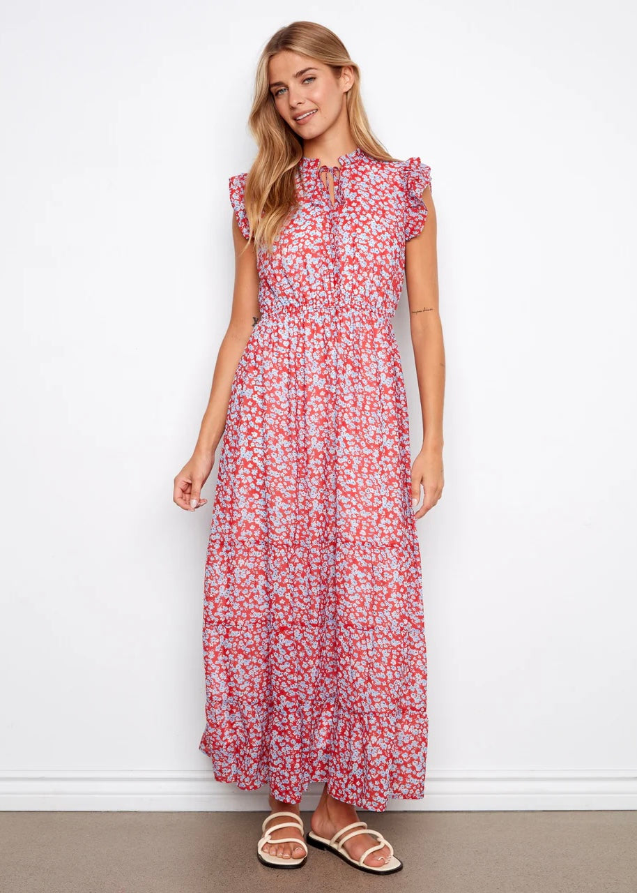 Woman wearing a floral dress against a white background