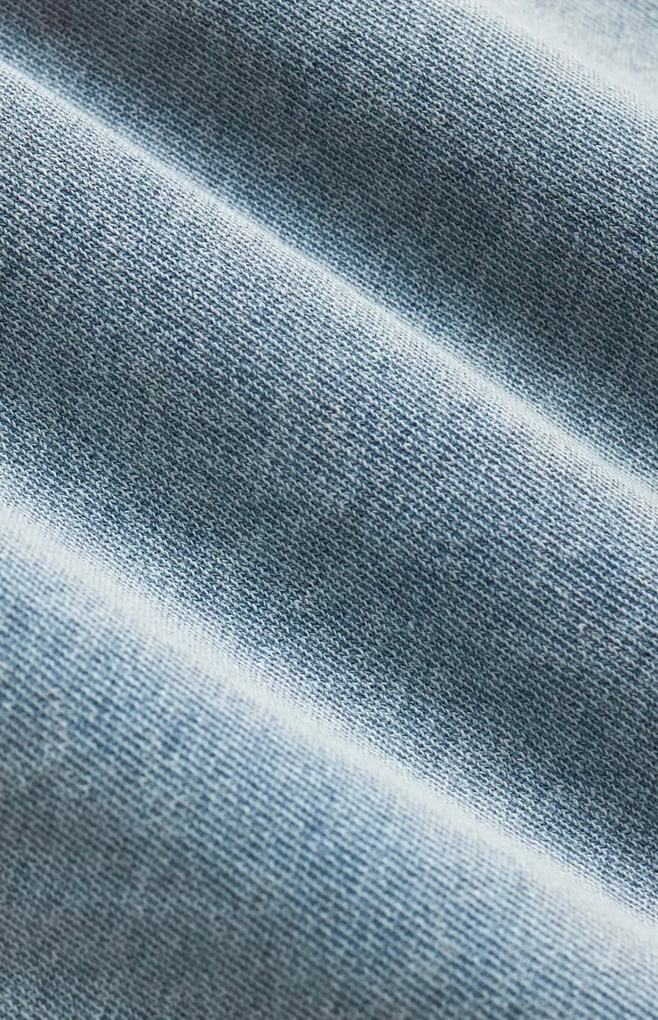 Close-up of textured blue fabric with a gradient effect