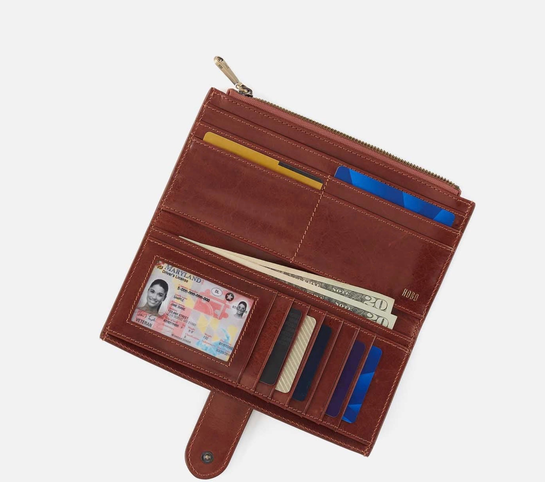 Brown leather wallet with various compartments on a white background
