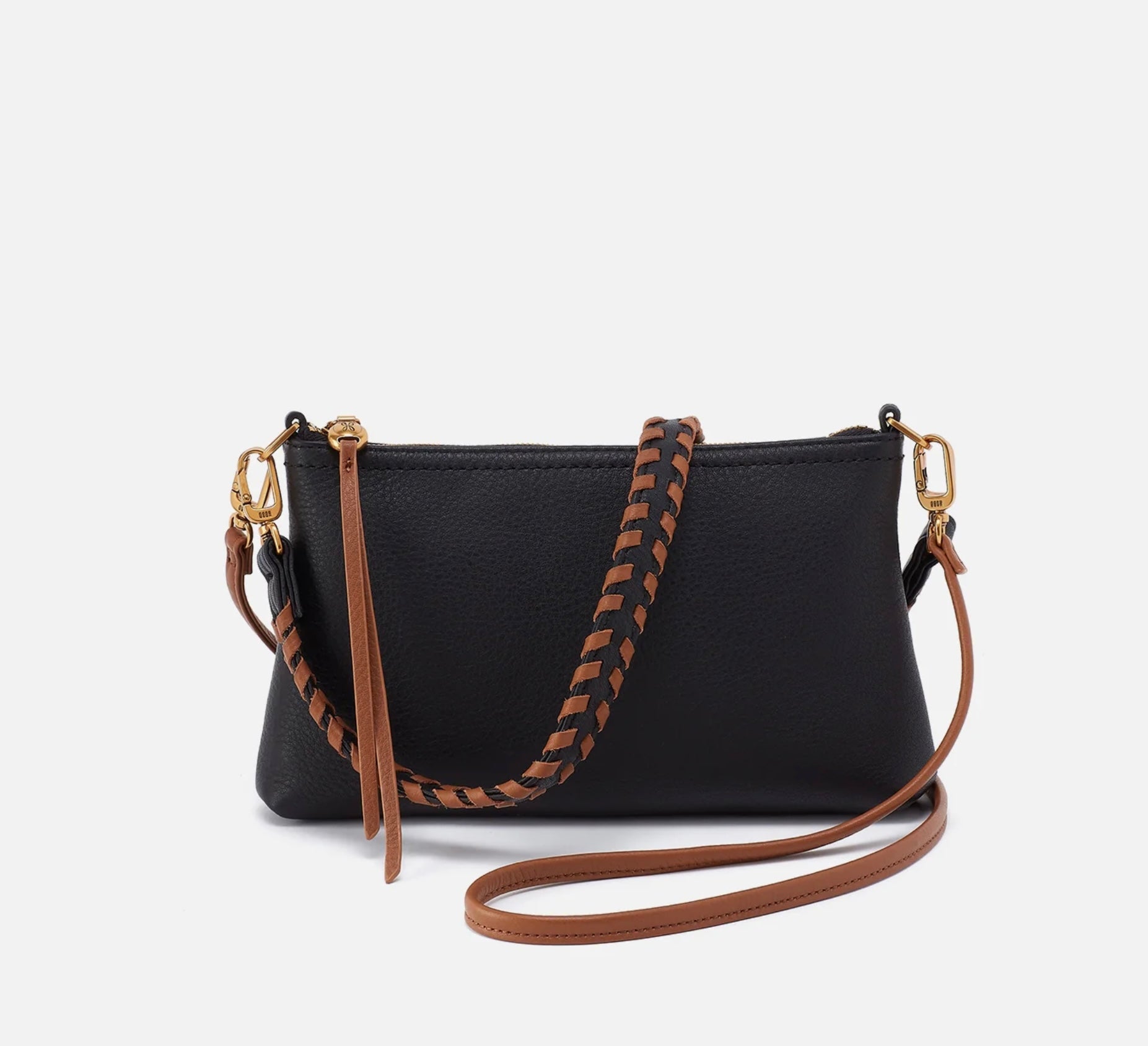 Black handbag with brown strap on a white background